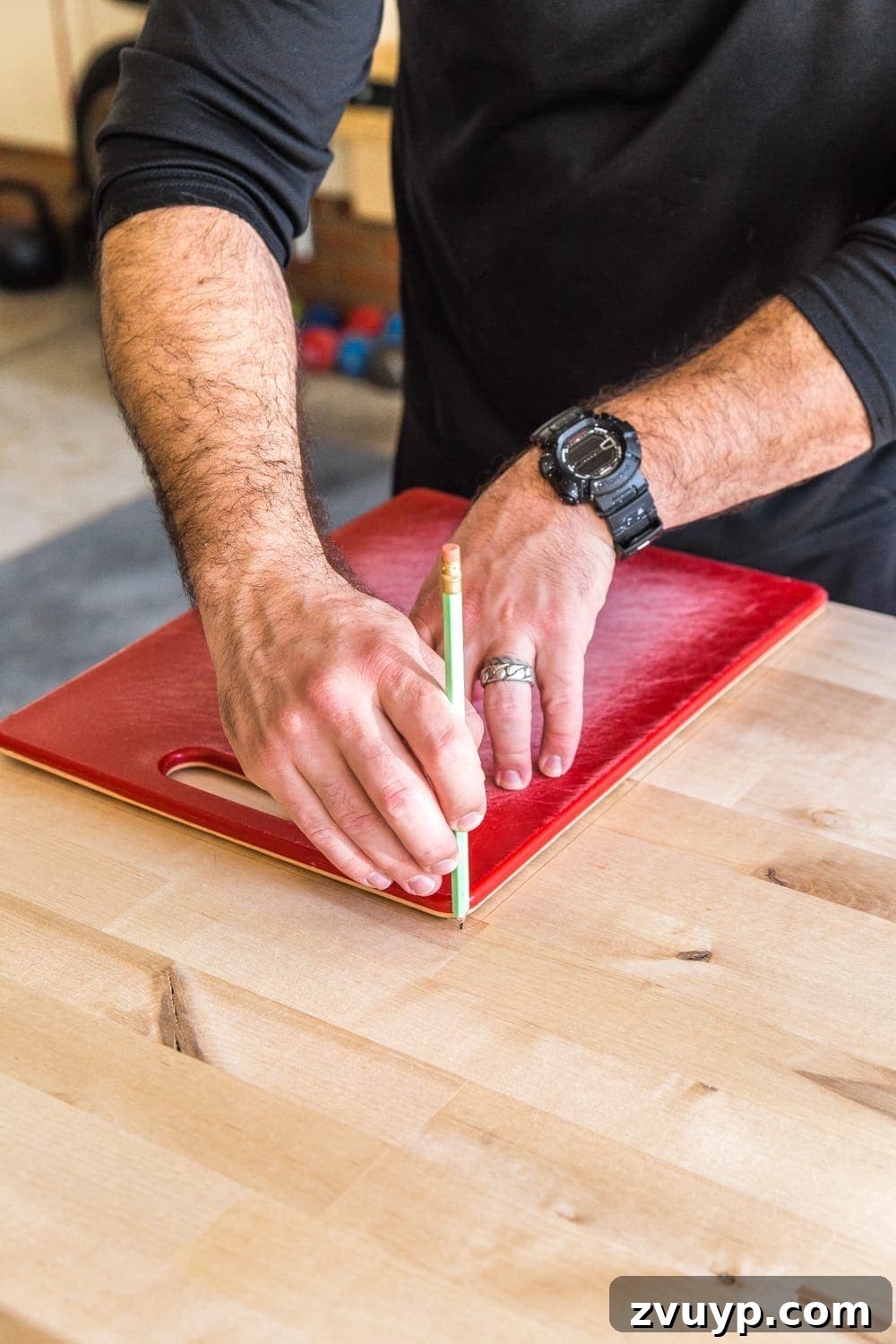 Crafting Custom Cutting Boards from Leftover Wood 5 Tracing a cutting board template onto scrap wood with a pencil.