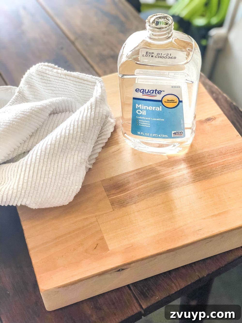 Crafting Custom Cutting Boards from Leftover Wood 8 Sanding a DIY cutting board to a smooth finish with various grits of sandpaper.