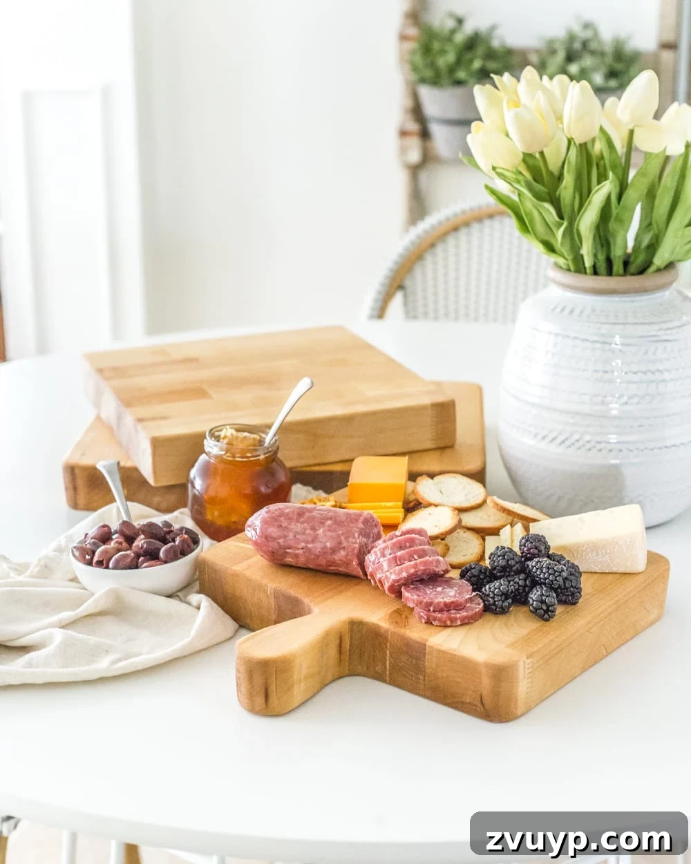 Crafting Custom Cutting Boards from Leftover Wood 10 A beautifully arranged charcuterie board on a homemade DIY cutting board, perfect for entertaining.