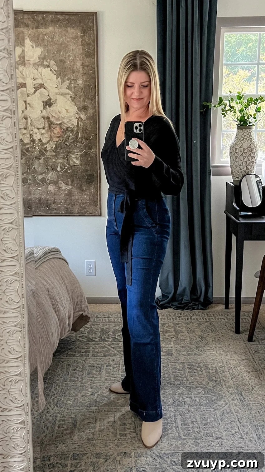 Smooth Silhouette: 10 Fashion Tricks to Flatter Your Mom Belly 10 black wrap top and trouser jeans outfit to hide a belly