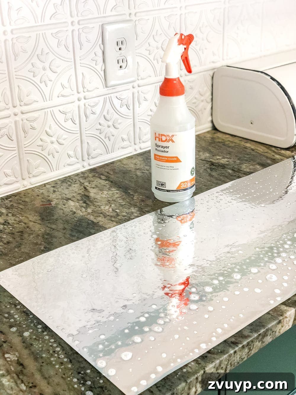 IKEA Hemnes Pantry Hack 13 Spritzing antique mirror film with water and soap solution for smooth application onto glass