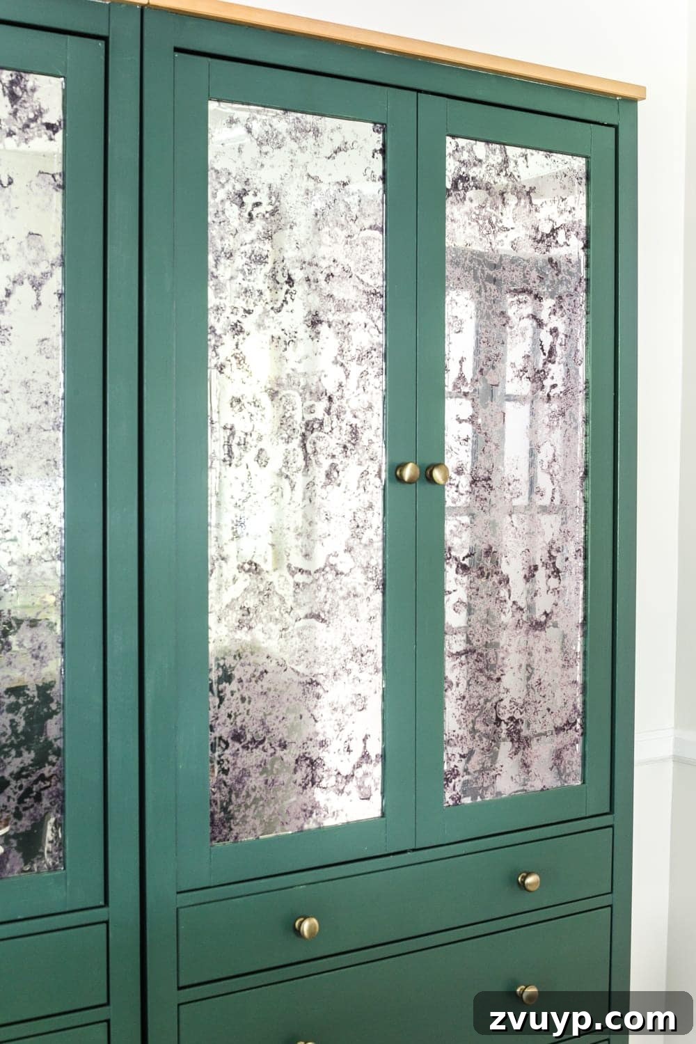 IKEA Hemnes Pantry Hack 15 Smoothing out antique mirror film on the IKEA Hemnes cabinet glass for a DIY pantry