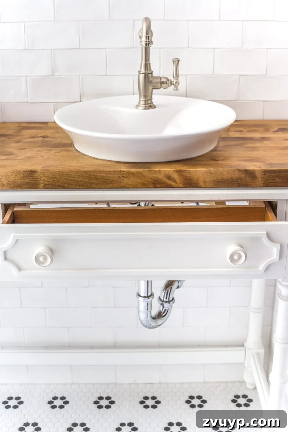 Upgrade Your Console Table to a Stunning Bathroom Vanity 15 The finished repurposed console table transformed into a charming bathroom vanity with vessel sinks.