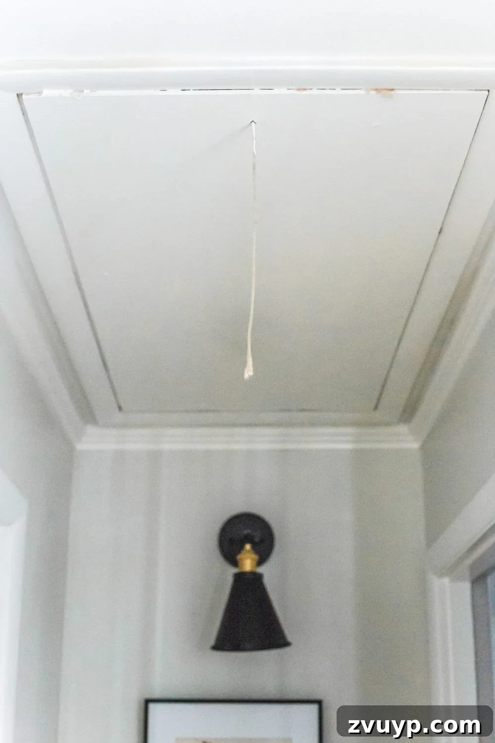 Upgrade Attic Door String to a Hook 4 Close-up of an old, frayed, and dirty attic door pull string, highlighting its worn appearance.