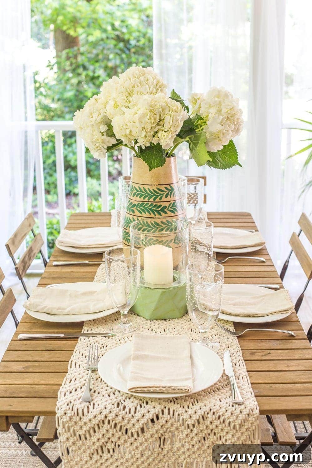 Bohemian Summer Sanctuary 11 A beautiful arrangement of fresh hydrangeas in a vase on an outdoor dining table, enhancing the summer porch decor.