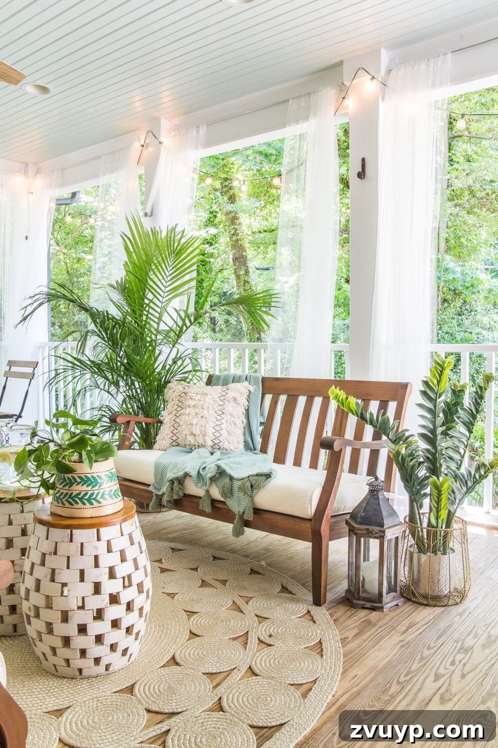 Bohemian Summer Sanctuary 13 Tropical boho back porch decorated with string lights, comfortable seating, and plants, creating a welcoming summer space.