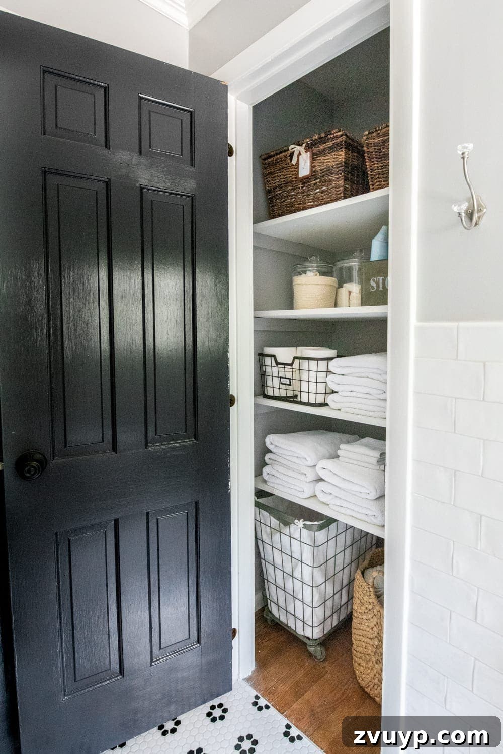 Unveiling the Ultimate Kids Bathroom Makeover 19 Functional linen closet organization featuring towels and bath essentials