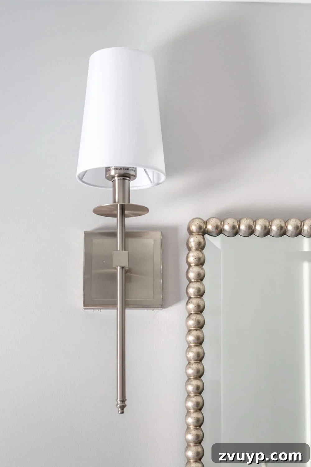 Traditional Shaded Sconces: Elegant bathroom lighting for a classic and girly space