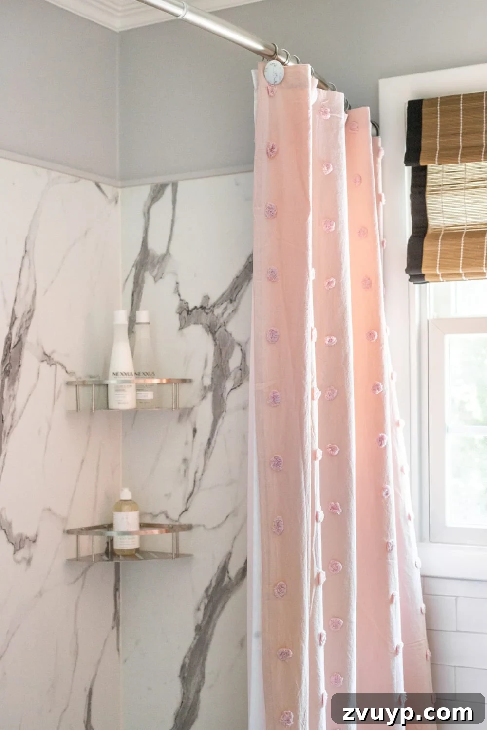 Blush Shower Curtain with Raised Polka Dots: Soft color accent in a classic bathroom with faux marble shower walls