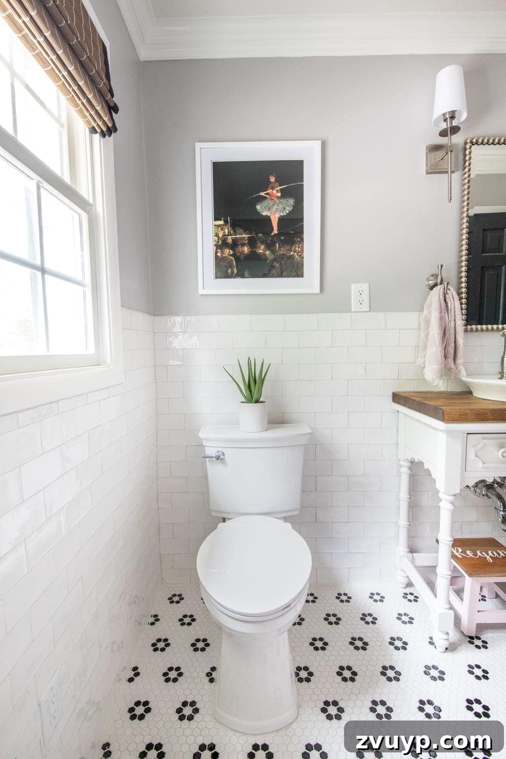 Vintage Tightrope Walker Art: Whimsical pink tutu print in a classic girls' bathroom with unique tile