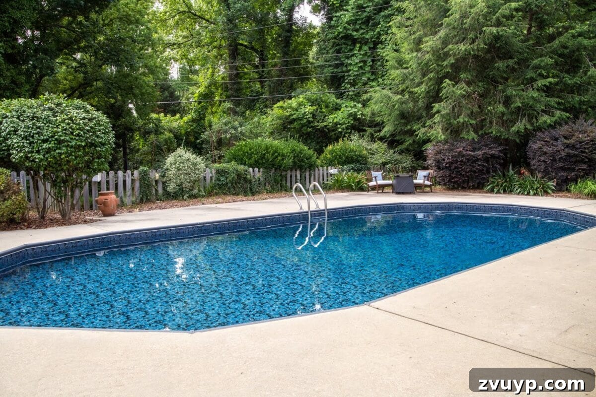 Our Pool's Stunning Liner Transformation 23 Swimming Pool Liner Makeover Reveal - Obsidian pool liner from GLI Pool Products TrueStone Collection, wide shot