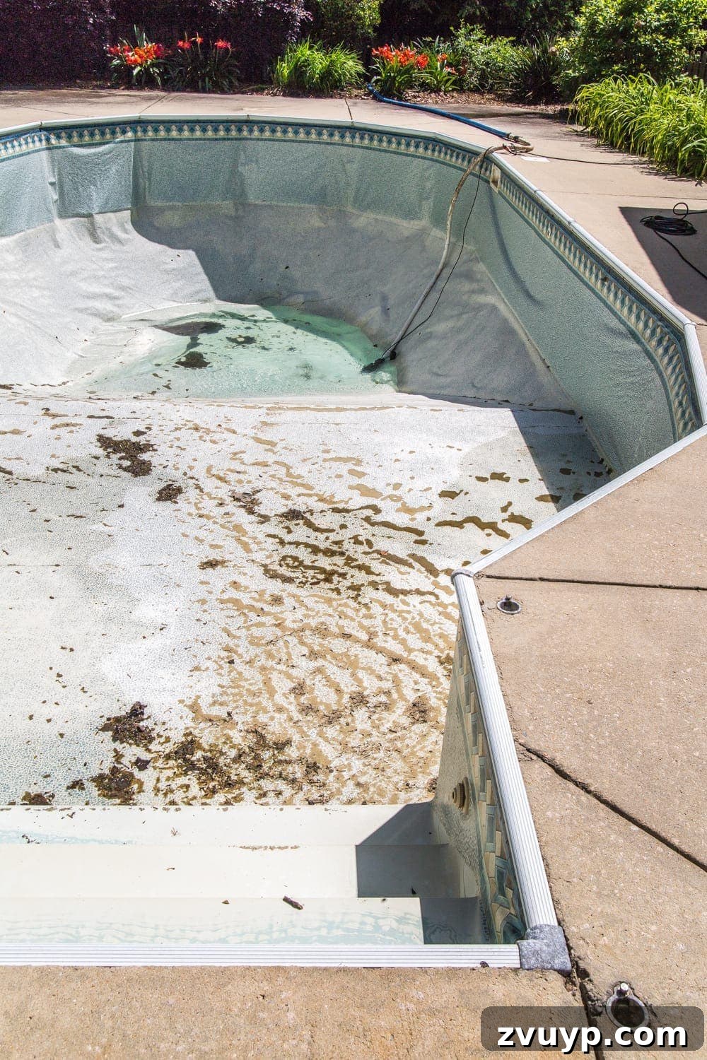 Our Pool's Stunning Liner Transformation 8 Swimming Pool Liner Makeover Reveal - before new liner installation, showing drained pool and old liner