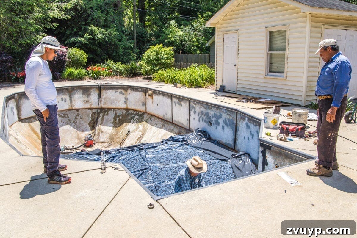 Our Pool's Stunning Liner Transformation 10 Swimming Pool Liner Makeover Reveal - professional vinyl pool liner installation in progress