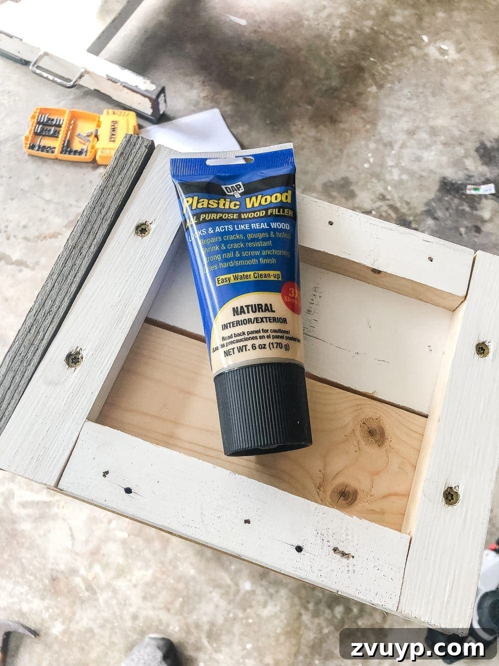 From Scraps to Blooms Window Box 17 Applying wood filler to DIY window box