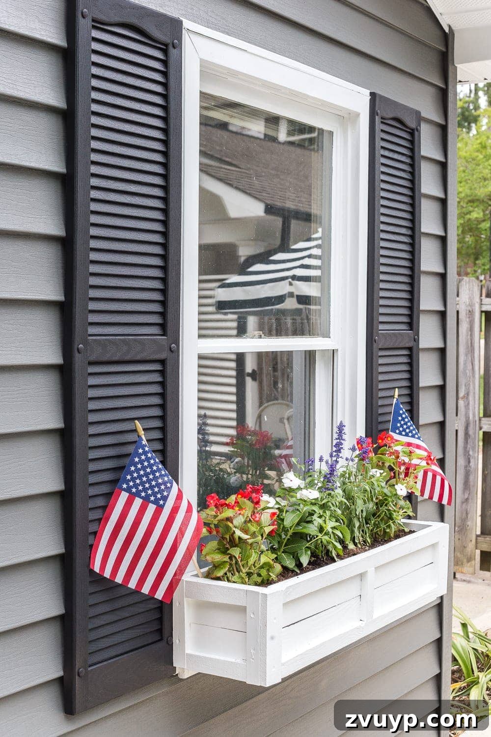 From Scraps to Blooms Window Box 24 DIY scrap wood window box with red, white, and blue flowers