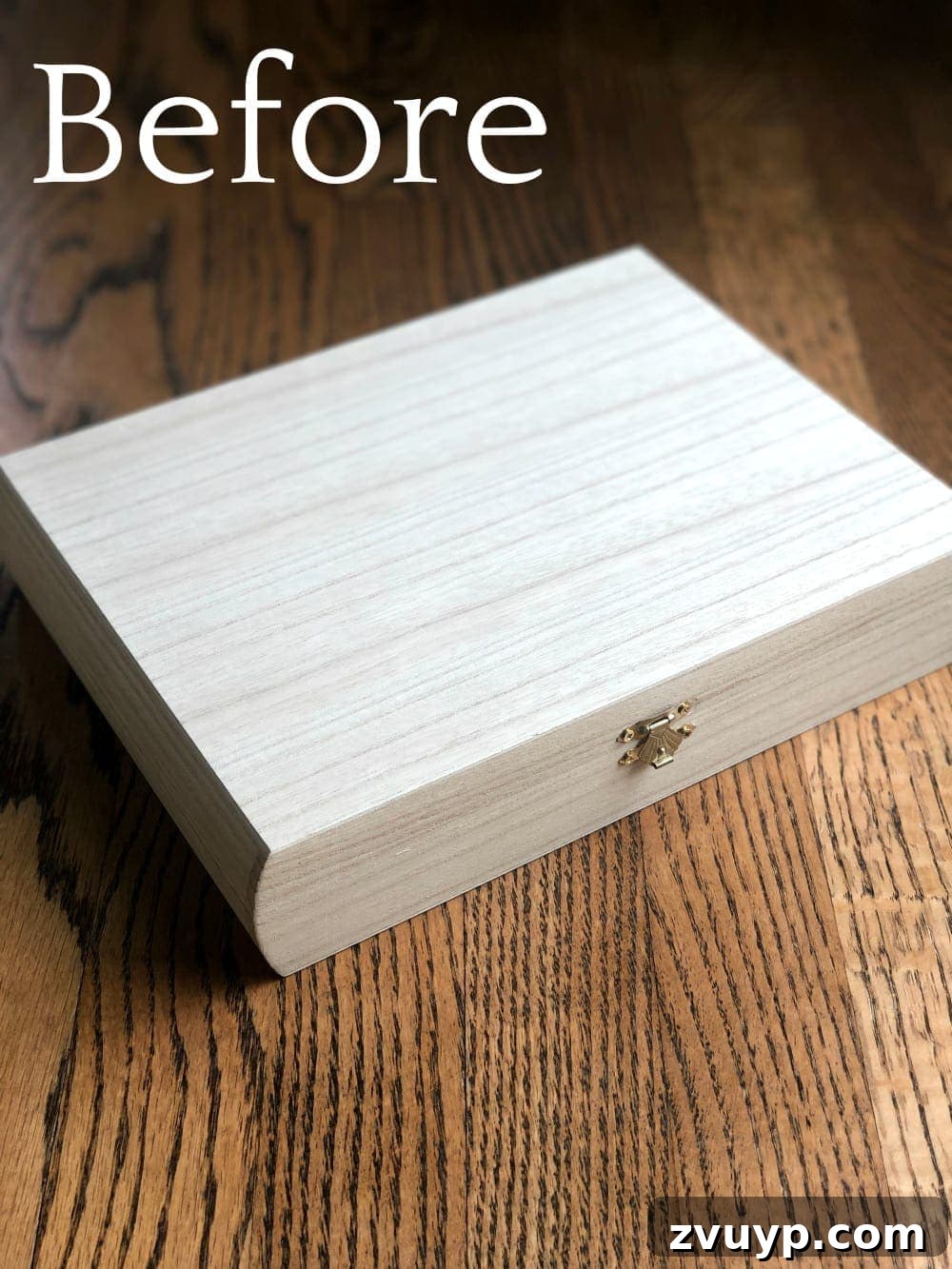 Cigar Box to Chic Faux Marble Remote Organizer 2 DIY marble contact paper remote control holder made from a repurposed cigar box, styled on a coffee table.