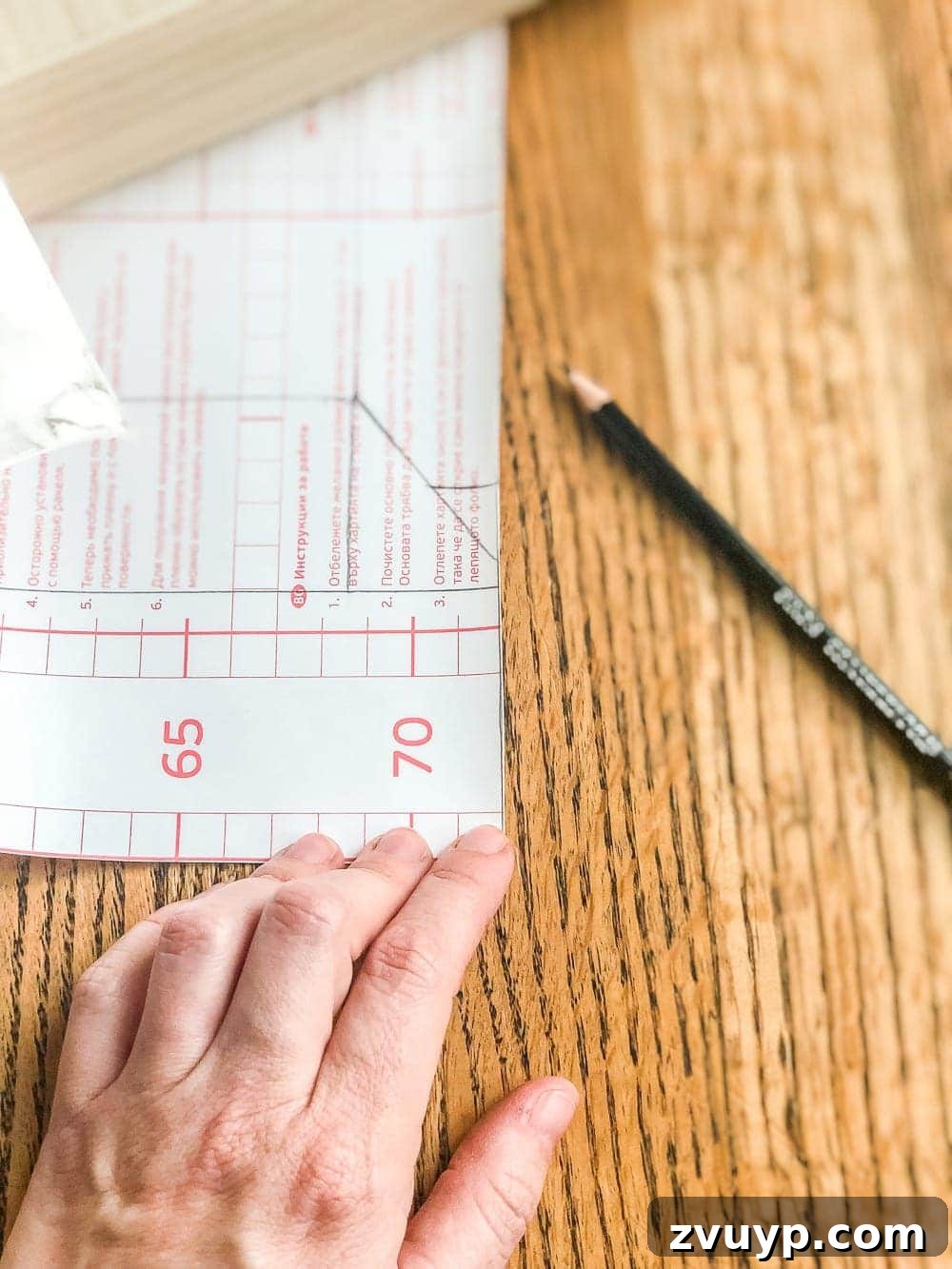 Cigar Box to Chic Faux Marble Remote Organizer 5 Pencil markings on contact paper showing diagonal and straight lines for precise wrapping of a cigar box.