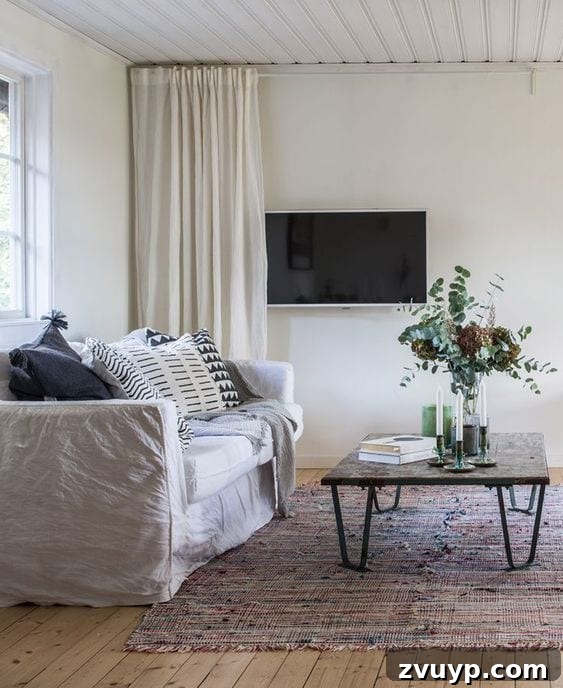 Beyond the Screen: Creative Ways to Style Your TV Area 7 Conceal TV behind a stylish curtain for a hidden media solution.
