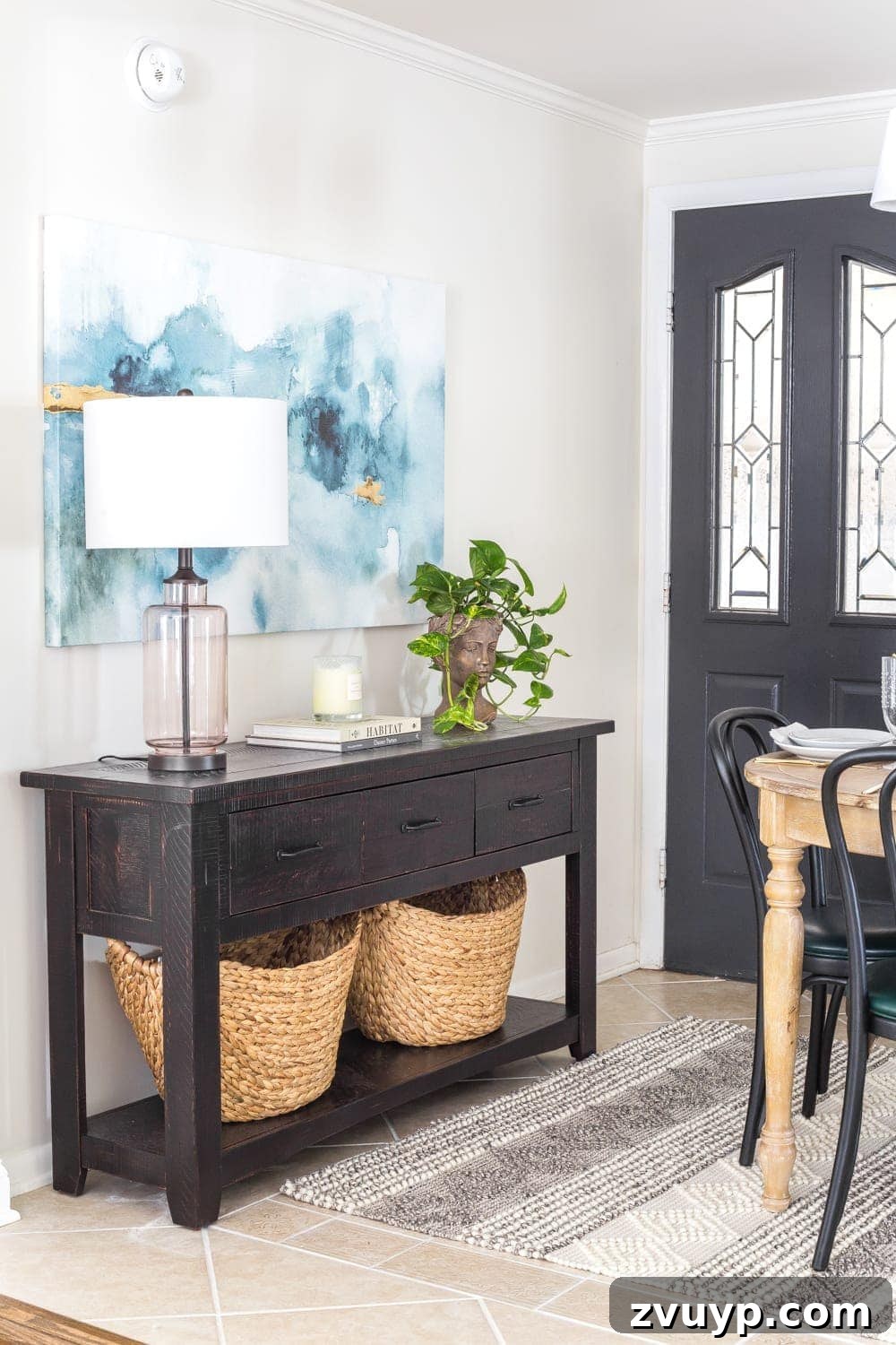 Breakfast Nook Glow Up 6 Black console table in a breakfast nook entryway for maximized storage and streamlined traffic.