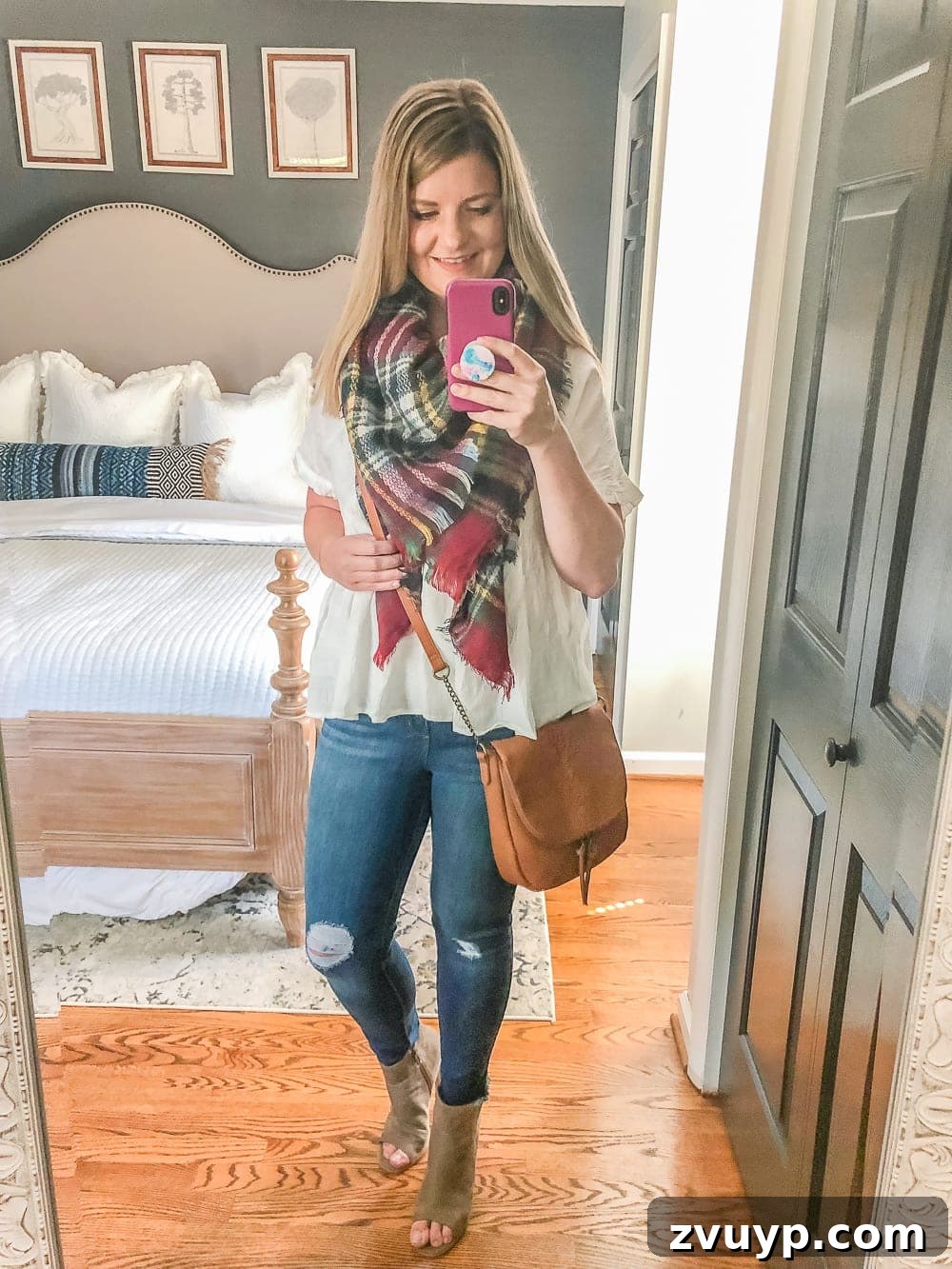 7 Stylish & Affordable Fall Outfits for a Flawless Fit 4 7 Inexpensive Tummy Hiding Mom Friendly Fall Outfits - flowy peplum blouse, plaid scarf, cognac crossbody bag, distressed jeans, peep toe booties