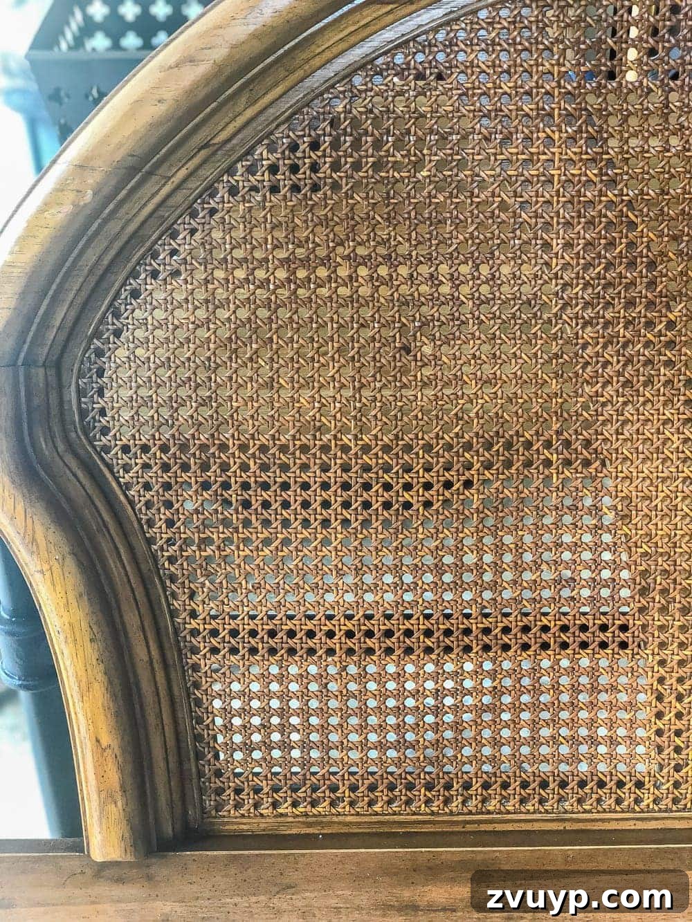 Revitalizing Old Cane Furniture 2 How to restore worn cane furniture: Vintage cane headboard before restoration, showing wear and tear.