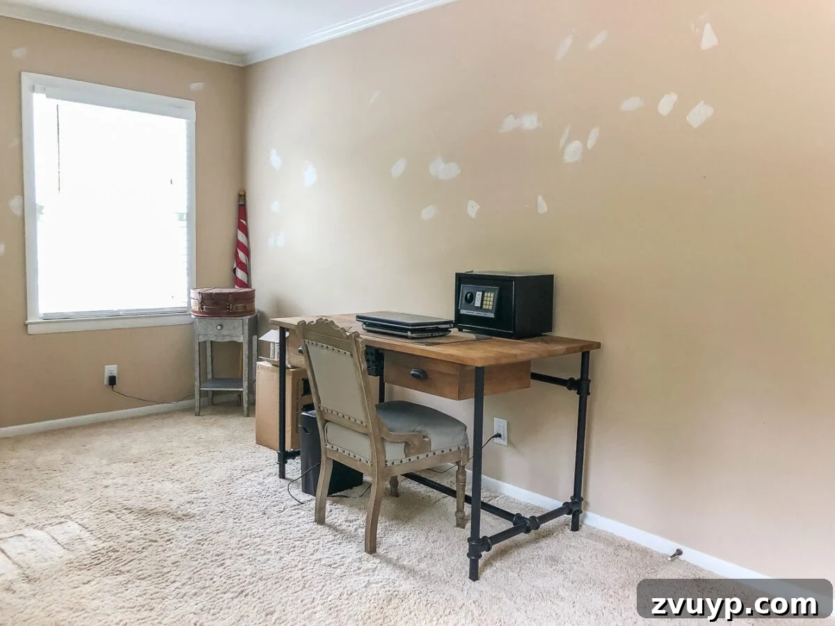 A boring guest bedroom gets a luxe, vintage chic makeover using thrifty projects, budget finds, and simple decorating tricks to maximize style and space. Before image of the guest bedroom showing a clear wall space.