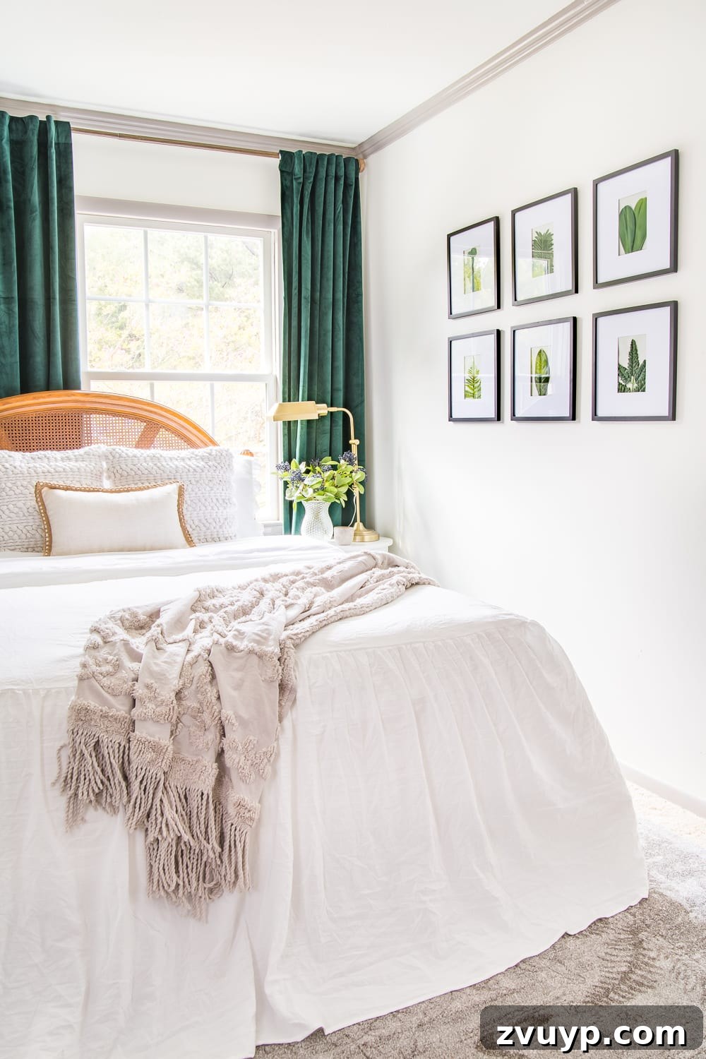 A boring guest bedroom gets a luxe, vintage chic makeover using thrifty projects, budget finds, and simple decorating tricks to maximize style and space. Simple framed leaf art adding natural touches to the guest bedroom.