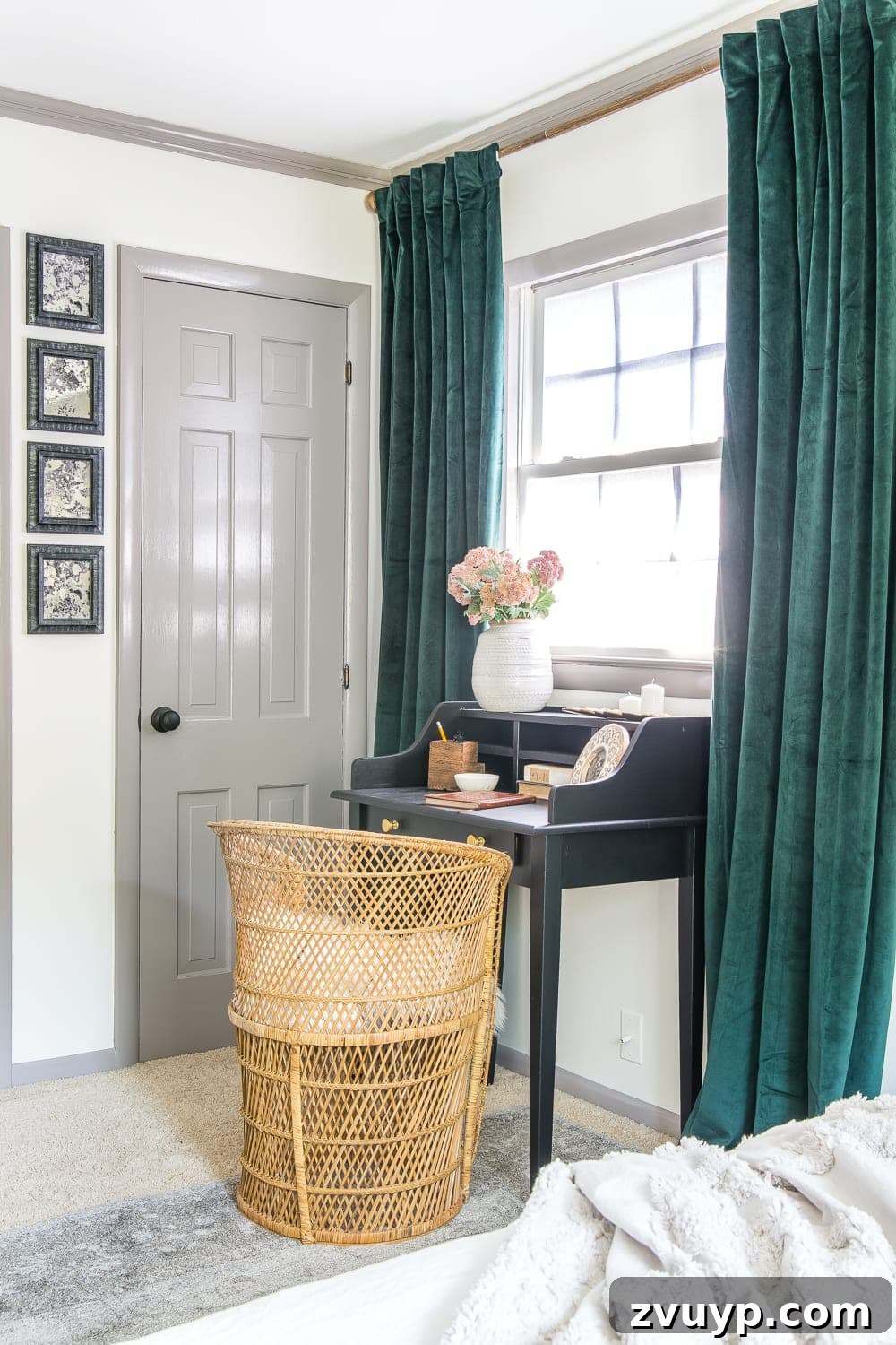 A boring guest bedroom gets a luxe, vintage chic makeover using thrifty projects, budget finds and simple decorating tricks to maximize style and space. Vintage desk and chair in the guest bedroom corner.
