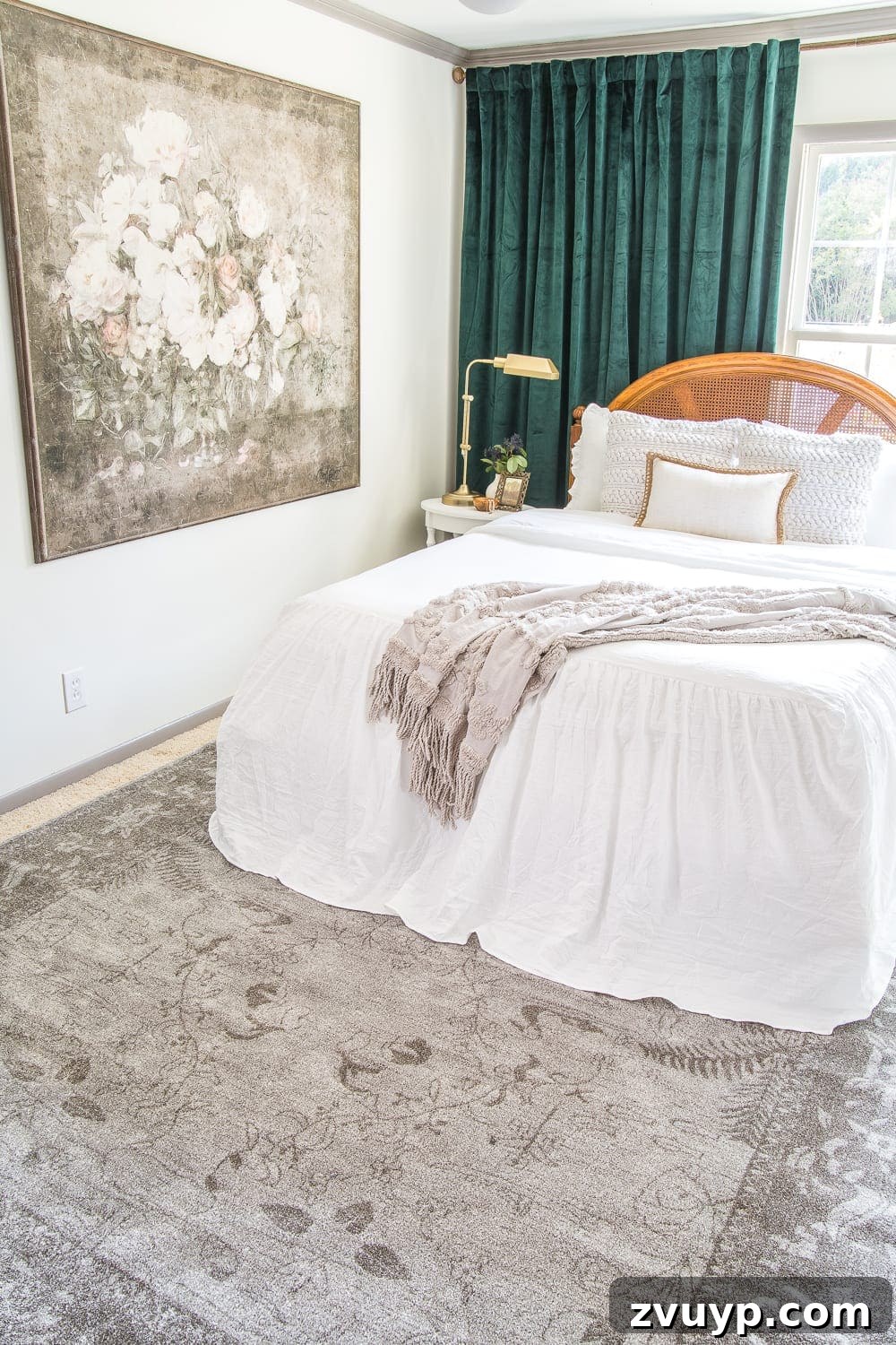 A boring guest bedroom gets a luxe, vintage chic makeover using thrifty projects, budget finds, and simple decorating tricks to maximize style and space. Elegant area rug tying together the room's decor.