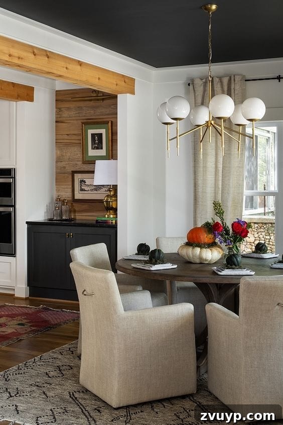 Black Paint: A Bold Design Statement 11 Elegant black living room with a statement chandelier and white sofa