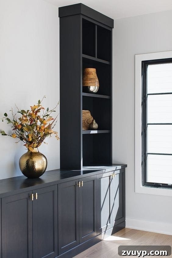 Black Paint: A Bold Design Statement 19 Luxurious black bedroom with a large window and elegant furnishings