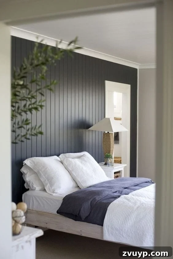 Black Paint: A Bold Design Statement 3 Modern black living room with a cozy fireplace and minimalist decor