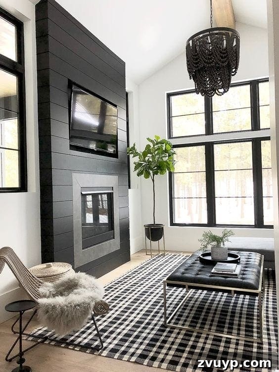 Black Paint: A Bold Design Statement 21 Stylish black kitchen with a large island and ample seating