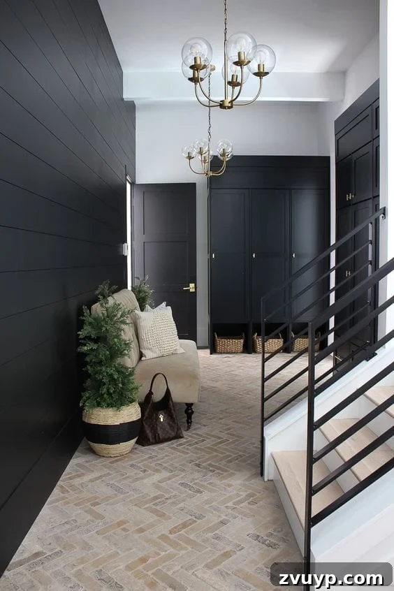 Black Paint: A Bold Design Statement 23 Elegant black mudroom with brick herringbone floors and wooden bench