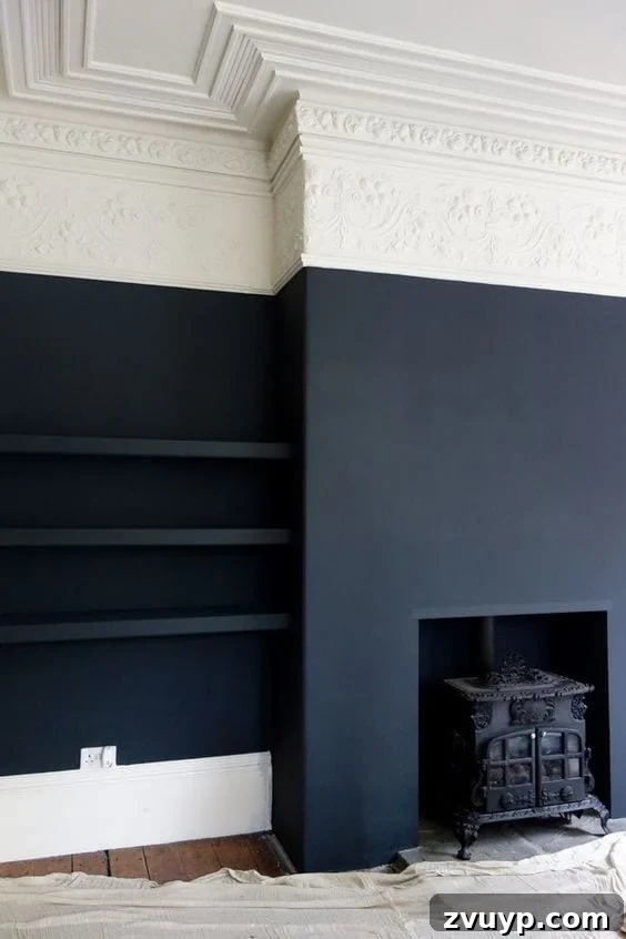 Black Paint: A Bold Design Statement 4 Chic black bedroom with soft textiles and layered bedding