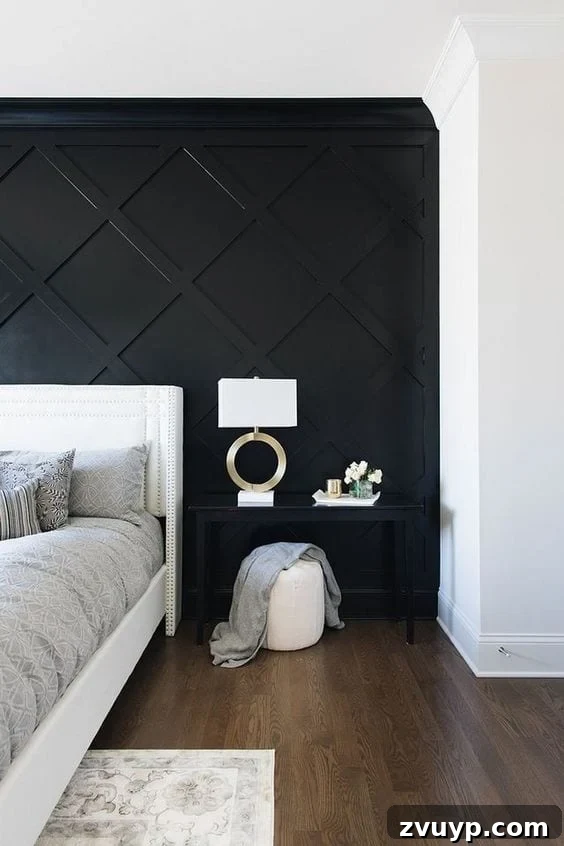 Black Paint: A Bold Design Statement 10 Bold black accent wall in a minimalist bedroom with a large window