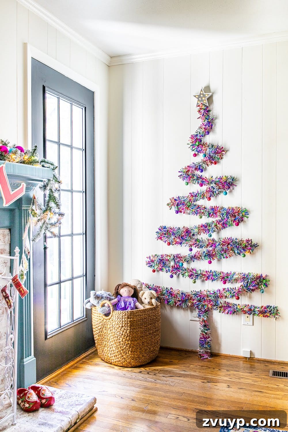 Thrifty Wall Christmas Tree with Twinkling Lights 3 finished DIY Christmas wall tree with colorful tinsel garland in a playroom