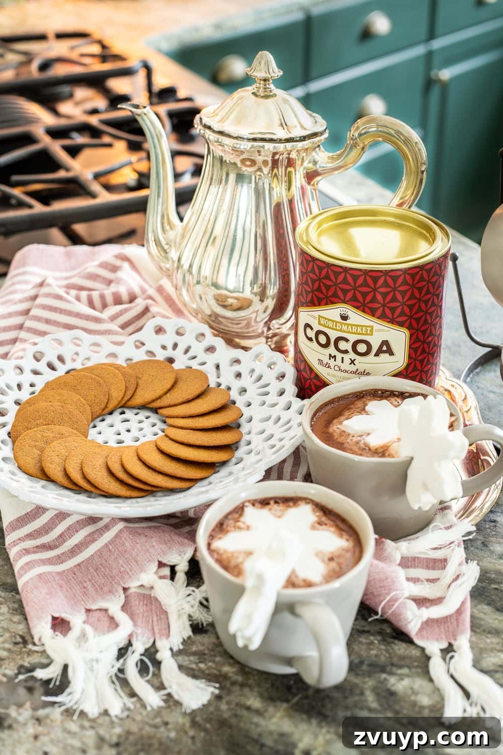 Weaving Past and Present: A Swedish Christmas Decor Story 5 Close-up of a festive Christmas hot cocoa bar setup, showcasing modern stone mugs, marshmallow toppers, and cocoa mix alongside traditional Swedish-inspired gingerbread cookies and warm lighting.