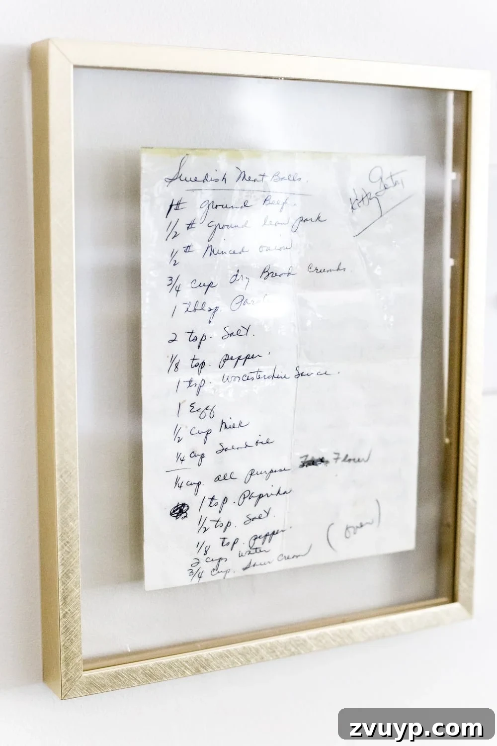 Weaving Past and Present: A Swedish Christmas Decor Story 8 A beautifully preserved and framed handwritten recipe, displayed as sentimental kitchen wall decor, adding a personal and historical touch to the home.