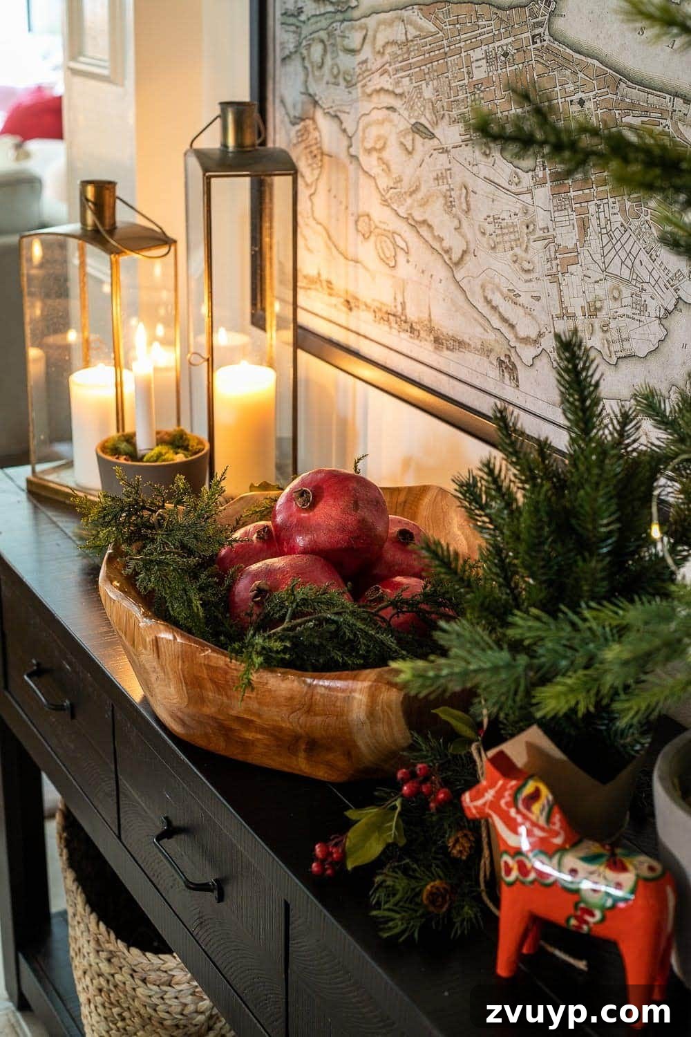 Weaving Past and Present: A Swedish Christmas Decor Story 9 A cozy Swedish Christmas vignette featuring a Dala horse, warm candlelight, and a bowl filled with vibrant pomegranates, creating a rich and traditional holiday atmosphere.