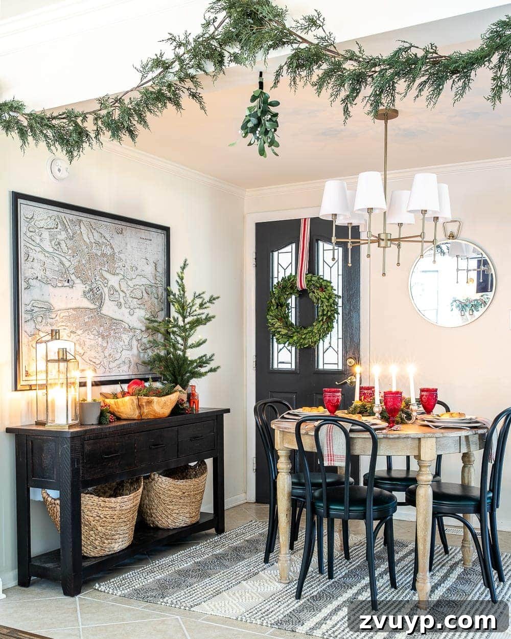 Festive Home Tour 16 Christmas decor ideas: A cozy breakfast nook adorned with realistic artificial garland and festive mistletoe, creating a charming holiday atmosphere perfect for family meals.