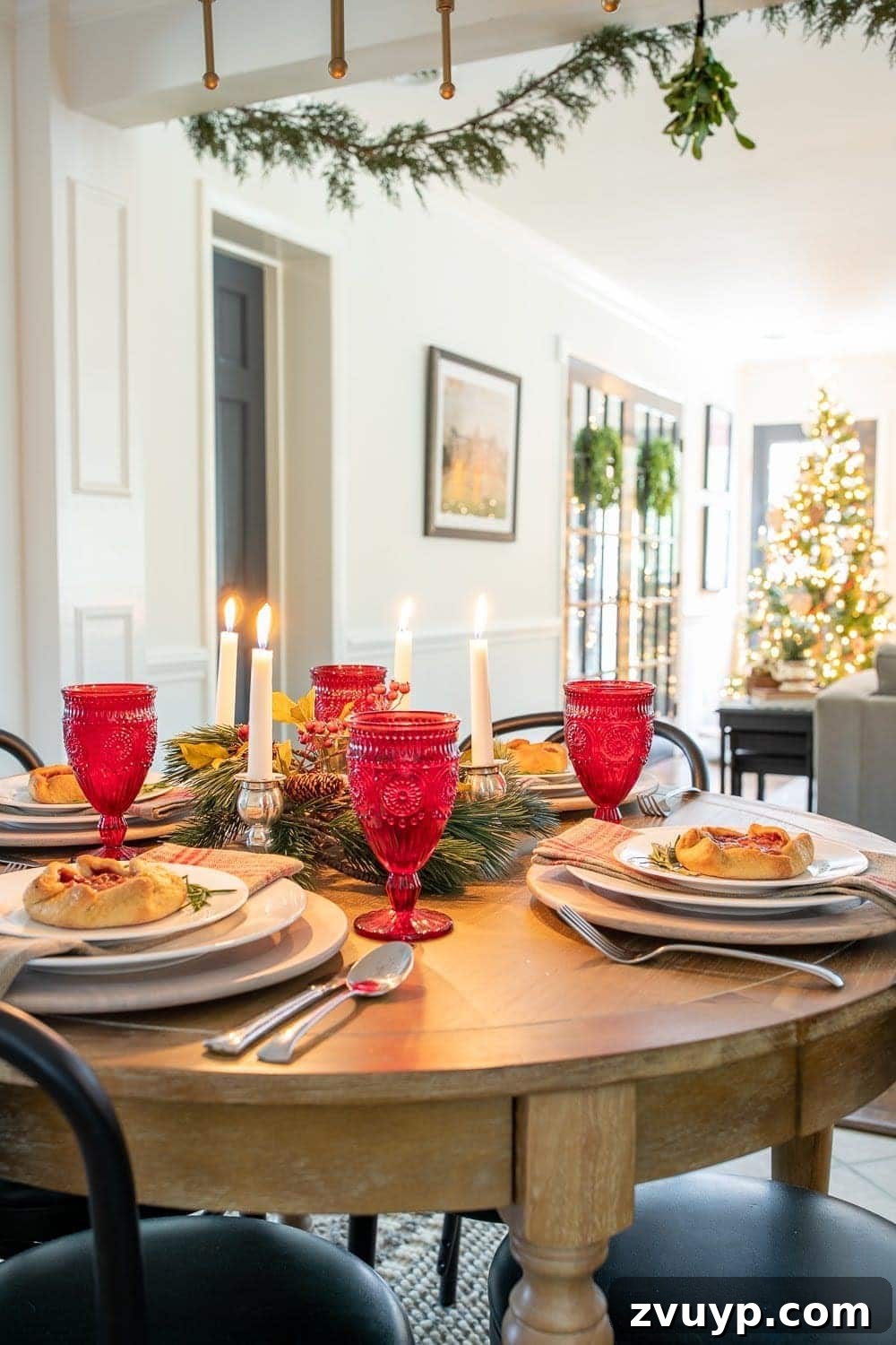 Festive Home Tour 19 Christmas decor ideas: A cozy tablescape on a round table, beautifully arranged for the holidays, creating an inviting and intimate dining experience.