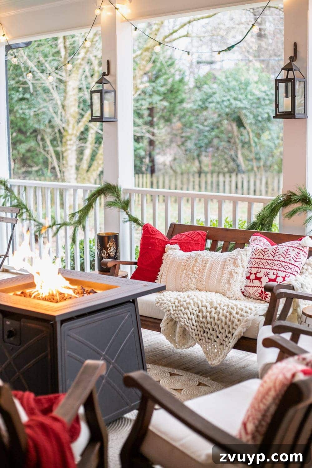 Warm Yuletide Veranda 12 Inviting Christmas back porch featuring a fire pit table, decorative lanterns, and ambient string lights