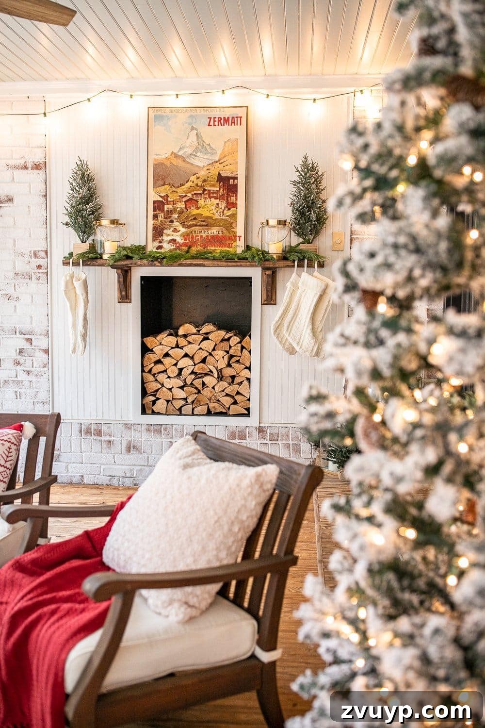 Warm Yuletide Veranda 5 Decorative faux fireplace adorned with a neatly stacked woodpile and festive Christmas decor
