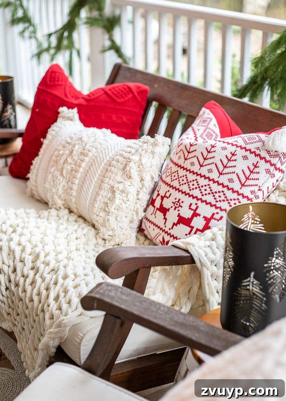 Warm Yuletide Veranda 6 Assortment of cozy Christmas-themed pillows and blankets for outdoor comfort