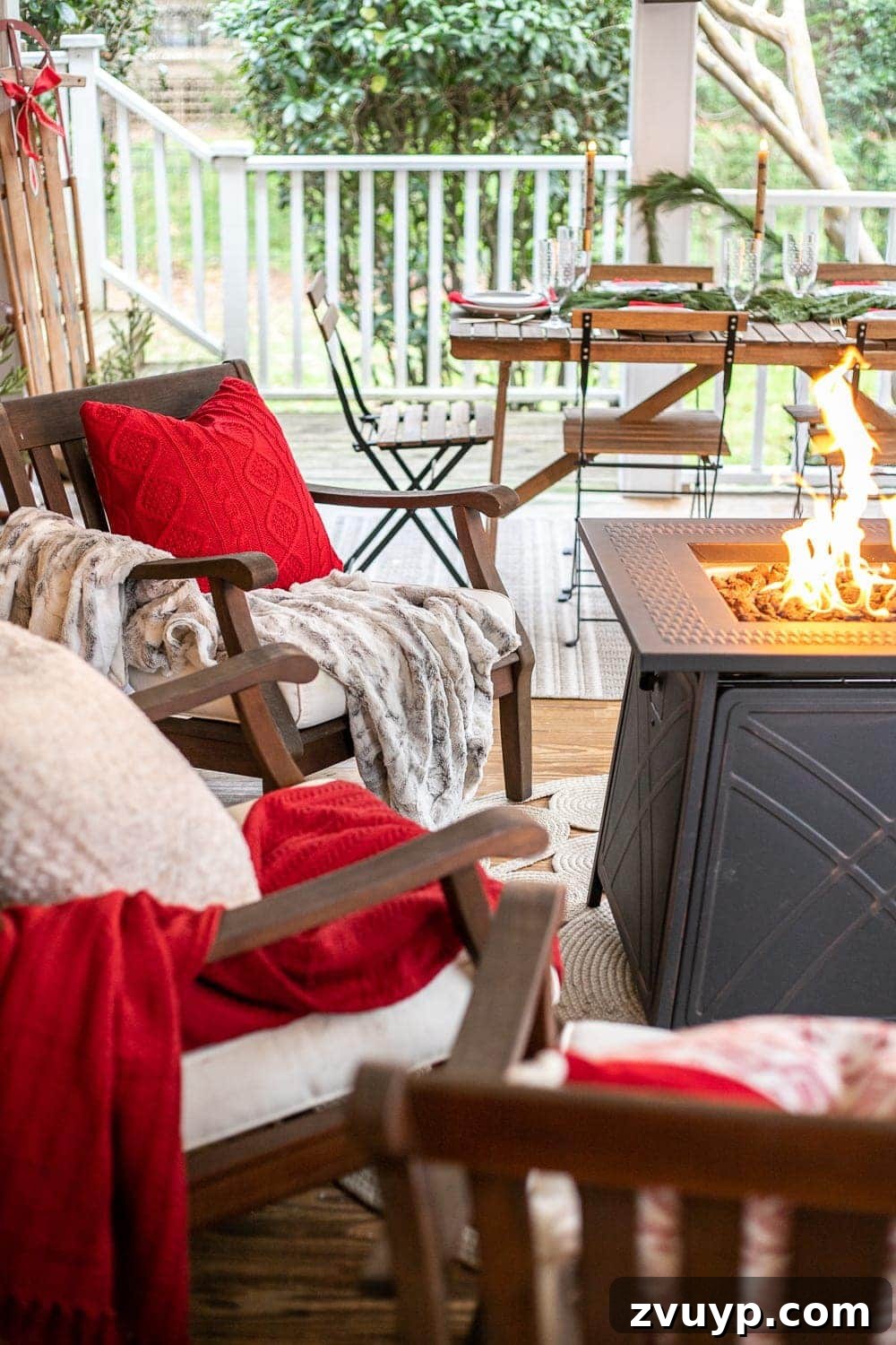 Warm Yuletide Veranda 8 Festive back porch with red blankets, cozy pillows, and a glowing fire pit table