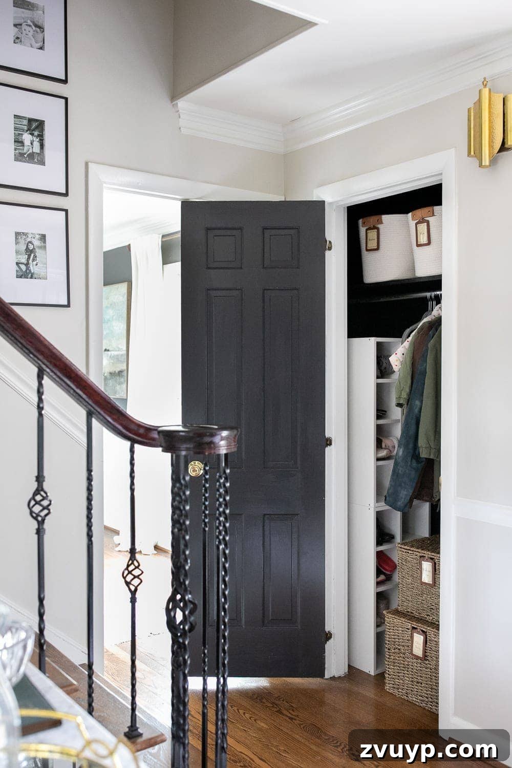 Smart Coat Closet Organization 11 Fully organized hallway closet in an entryway, featuring neatly hung coats, labeled bins, and accessible storage.