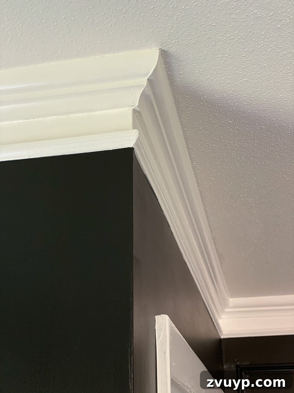 Elevate Your Edges: Simple Hacks for More Substantial Molding 4 Finished look of beefed-up crown molding. One easy trick to make thin crown molding and baseboards thicker and more stately for less than $1 per foot.