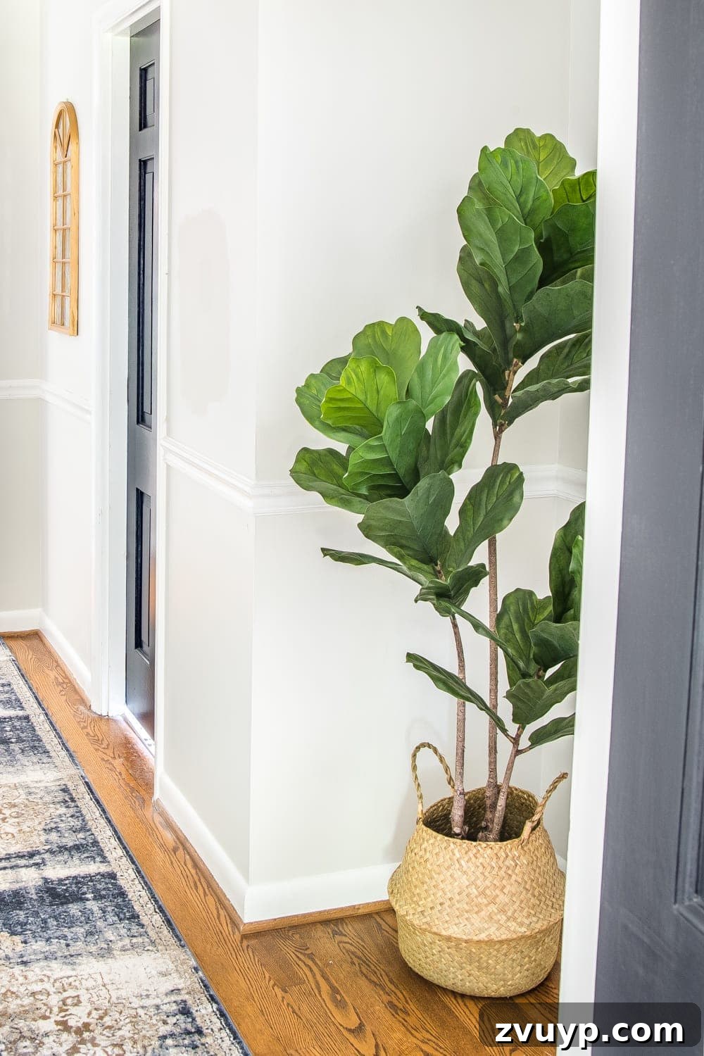 The Items That Defined My 2019 12 Realistic faux fiddle leaf fig tree standing in a stylish hallway.