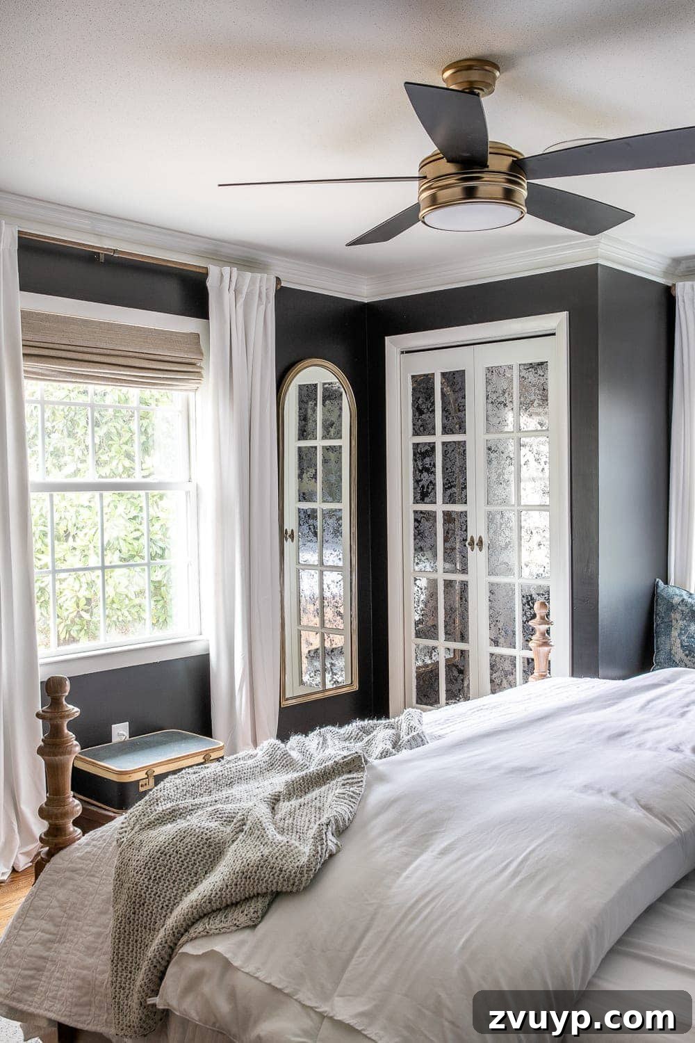 A Masterpiece in Mood: Our Modern Vintage Master Bedroom Unveiled 11 Master bedroom with elegant French bifold closet doors painted in Benjamin Moore Simply White, featuring antique mirror film and gold and glass knobs.